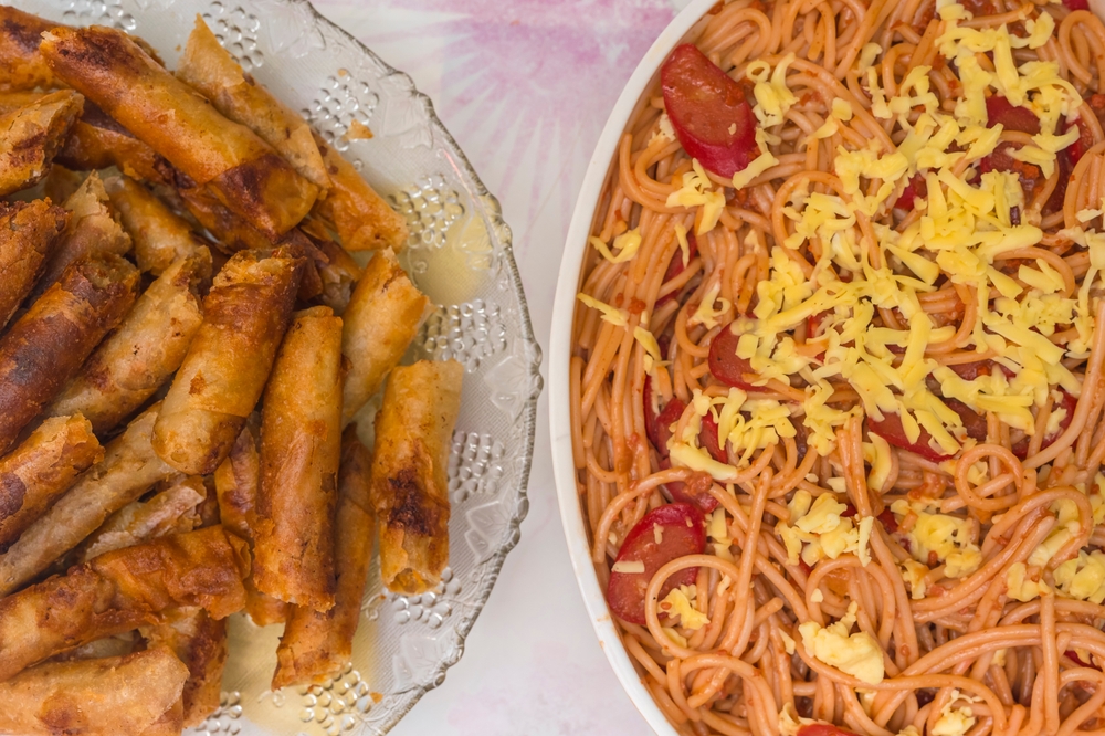 Plates of lumpiang Shanghai and Filipino spaghetti